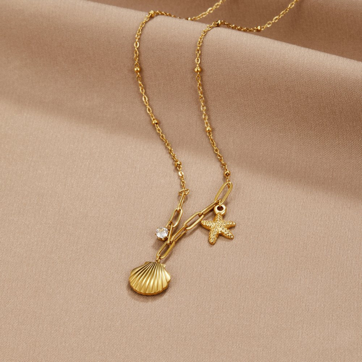 COLAR DE ESTRELA DO MAR COM CONCHA DOURADA